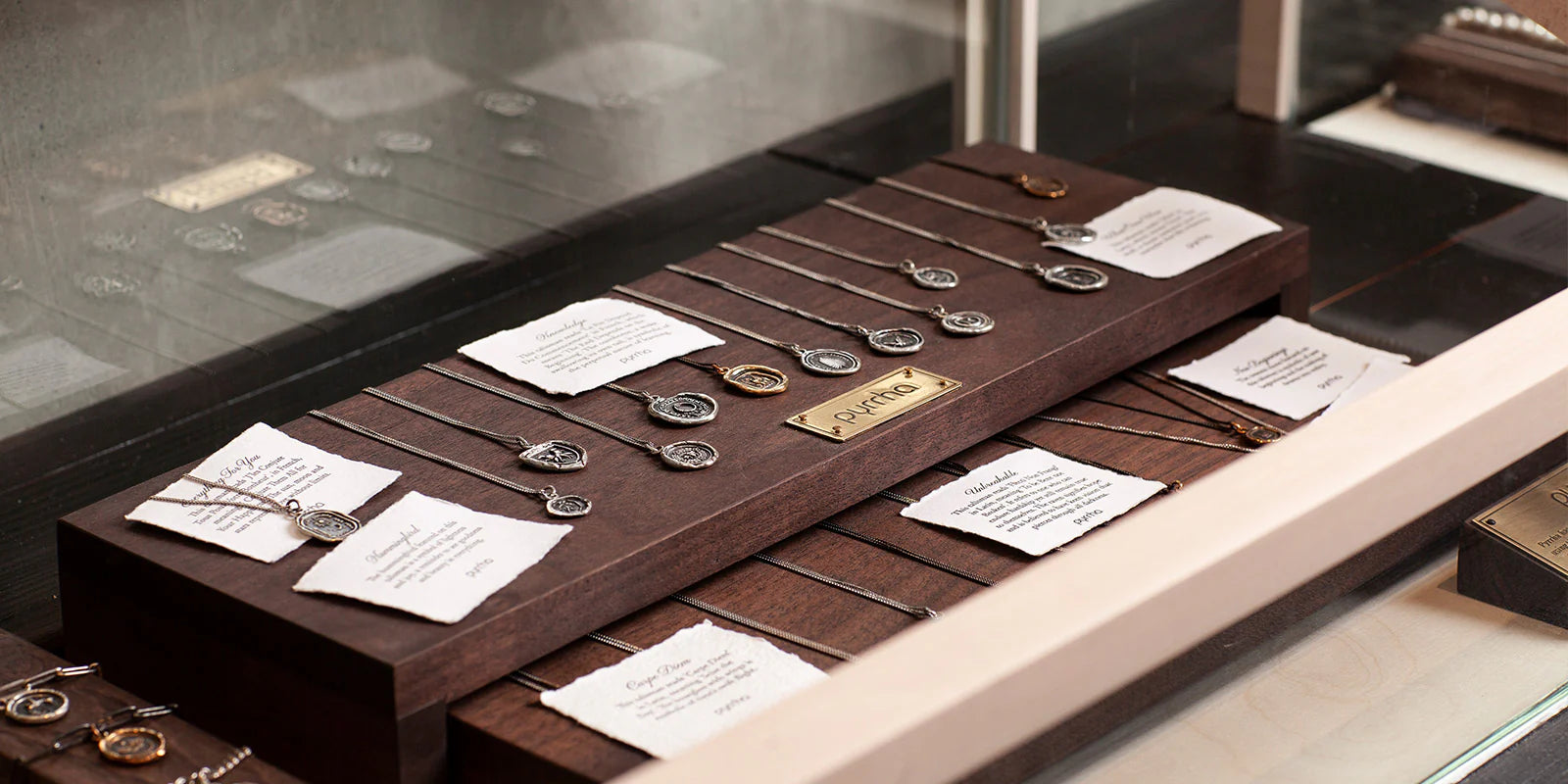 Symbolic jewelry displayed in the PORMENT showroom
