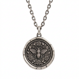 Talisman of Growth pendant featuring a honeybee surrounded by roses and leaves, on a chain against a white background.
