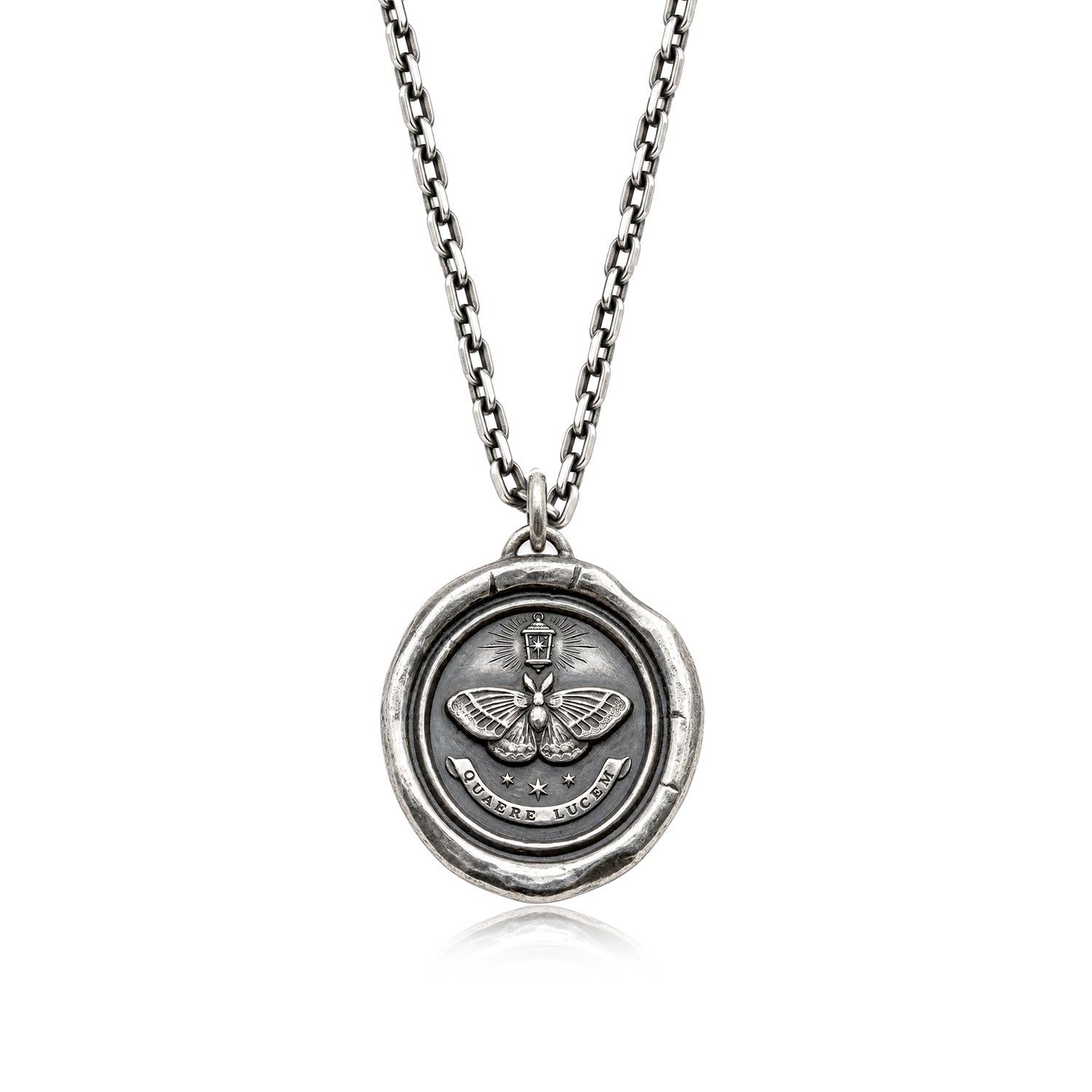 Moth talisman pendant with a lantern, three stars and QUAERE LUCEM inscription, on a chain against a white background.