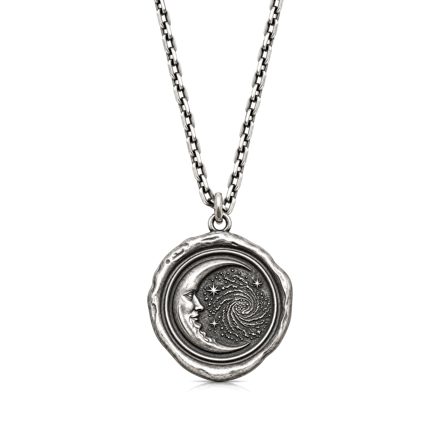 Trust the Universe talisman pendant with a crescent moon face, stars and spiral motif, on a chain against a white background.