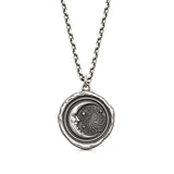 Trust the Universe talisman pendant with a crescent moon face, stars and spiral motif, on a chain against a white background.